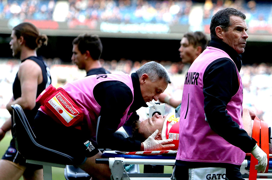 AFL 2015 Rd 12 - Carlton v Port Adelaide MELBOURNE, AUSTRALIA - JUNE 20: Robbie Gray of the Power is taken off on a stretcher during the 2015 AFL round twelve match between the Carlton Blues and Port Adelaide Power at the Melbourne Cricket Ground, Melbourne on June 20, 2015. (Photo by Justine Walker/AFL Media)